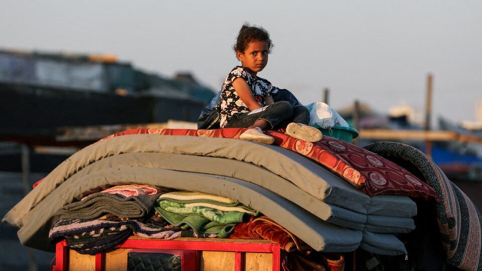 A Palestinian sits on top of belongings as he flees Rafah due to an Israeli military operation, amid the Israel-Hamas conflict, in Rafah, in the southern Gaza Strip, June 7, 2024. REUTERS/Hatem Khaled/File Photo