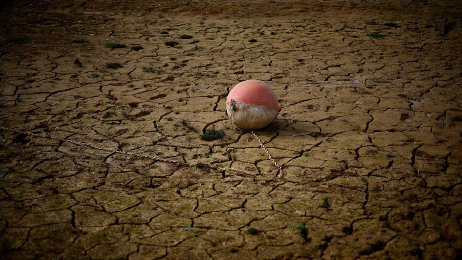 A buoy is seen on the banks of the partially dry Lake Montbel at the foot of the Pyrenees Mountains as France faces records winter dry spell raising fears of another summer of droughts and water restrictions, March 13, 2023. REUTERS/Sarah Meyssonnier/File