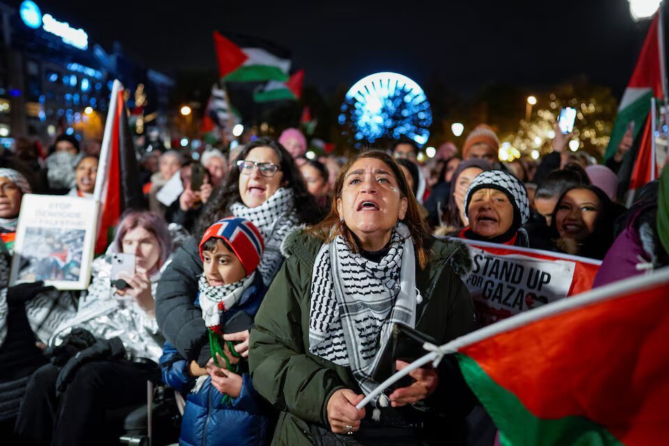 People attend a demonstration in support of Gaza and Palestinians, organised by the Palestine Committee, outside the building of the Norwegian parliament, Stortinget, in Oslo, Norway, November 4, 2023. Heiko Junge/NTB/via REUTERS