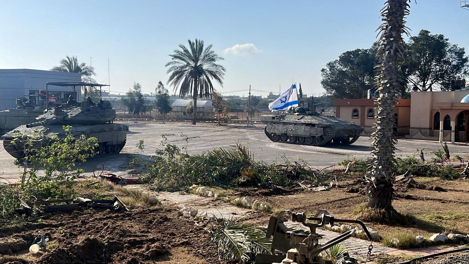 Israeli military vehicles operate in the Gazan side of the Rafah Crossing, amid the ongoing conflict between Israel and Palestinian Islamist group Hamas, in the southern Gaza Strip, in this handout image released on May 7, 2024. Israel Defense Forces/Handout via REUTERS THIS IMAGE HAS BEEN SUPPLIED BY A THIRD PARTY/File Photo
