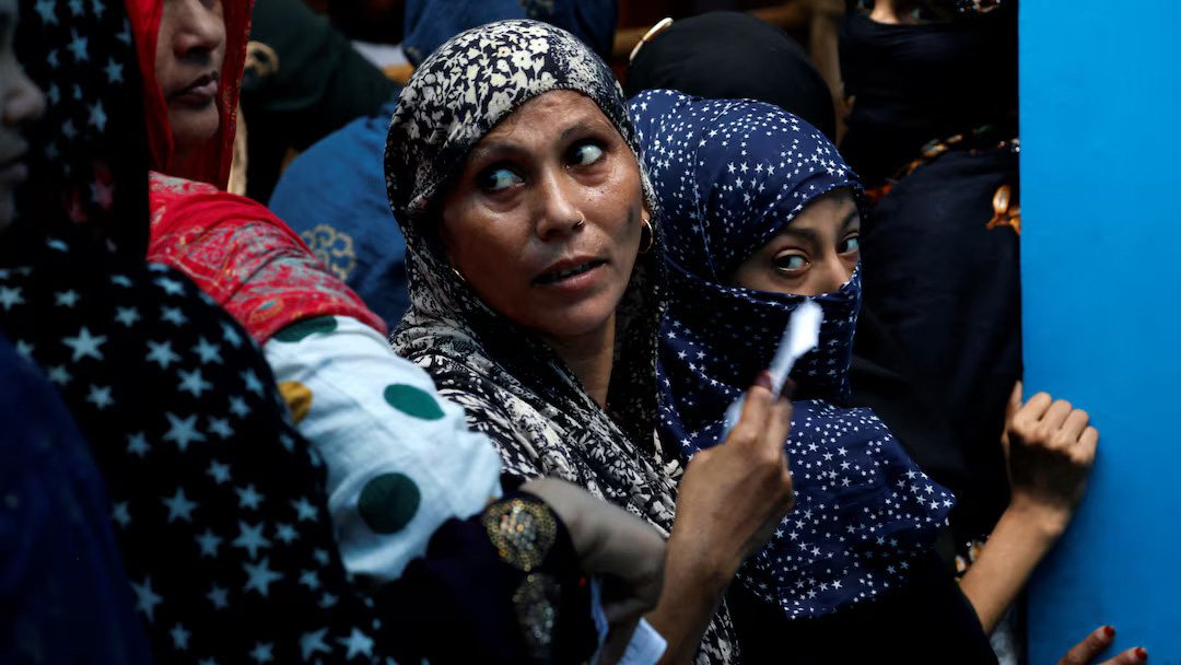 Women wait in a line to cast their votes at a polling station during the sixth phase of India’s general election in Jafrabad area of Delhi, India, May 25, 2024. Photo: Reuters.